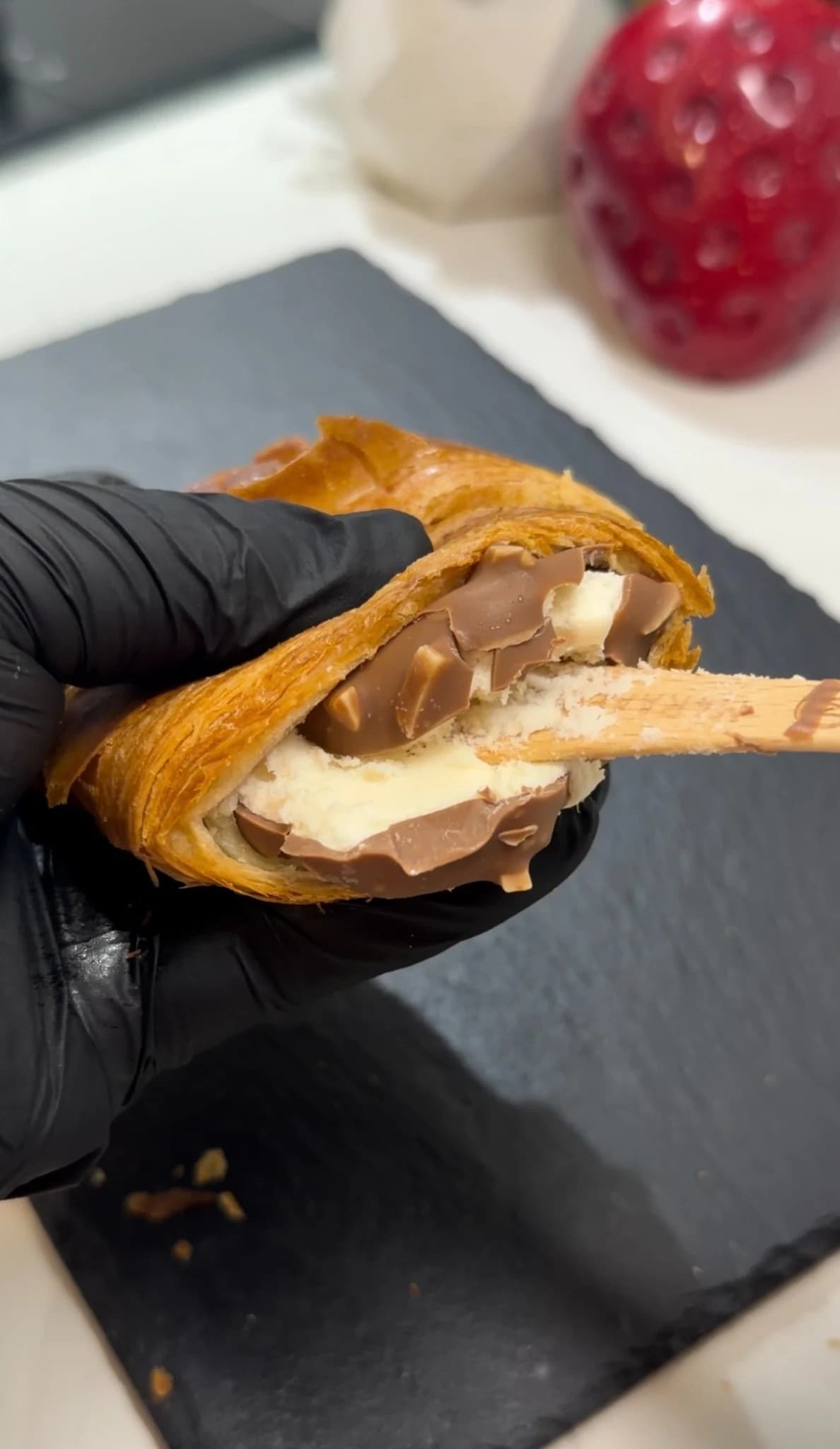 Croissant being closed around the Magnum ice cream bar