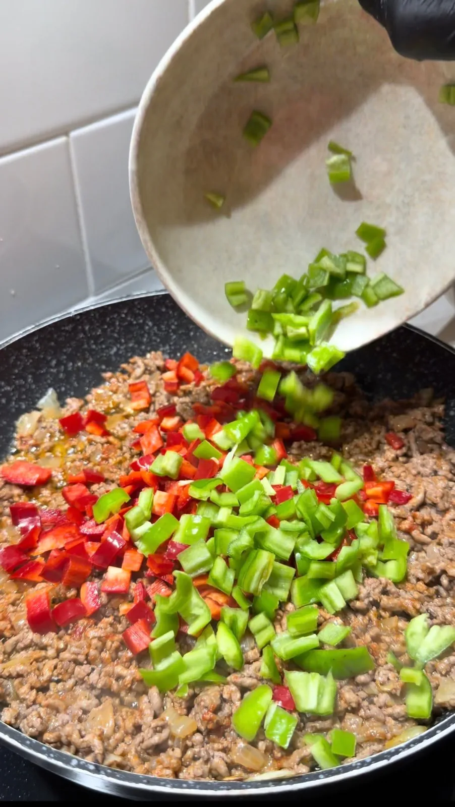 ground beef filling cooked with red and green peppers for baked eggplant casserole