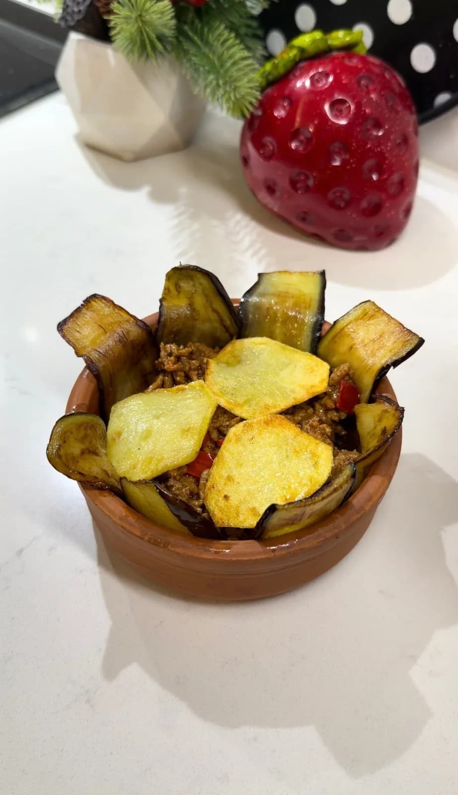 Cover the casserole generously with grated kasar cheese or mozzarella.