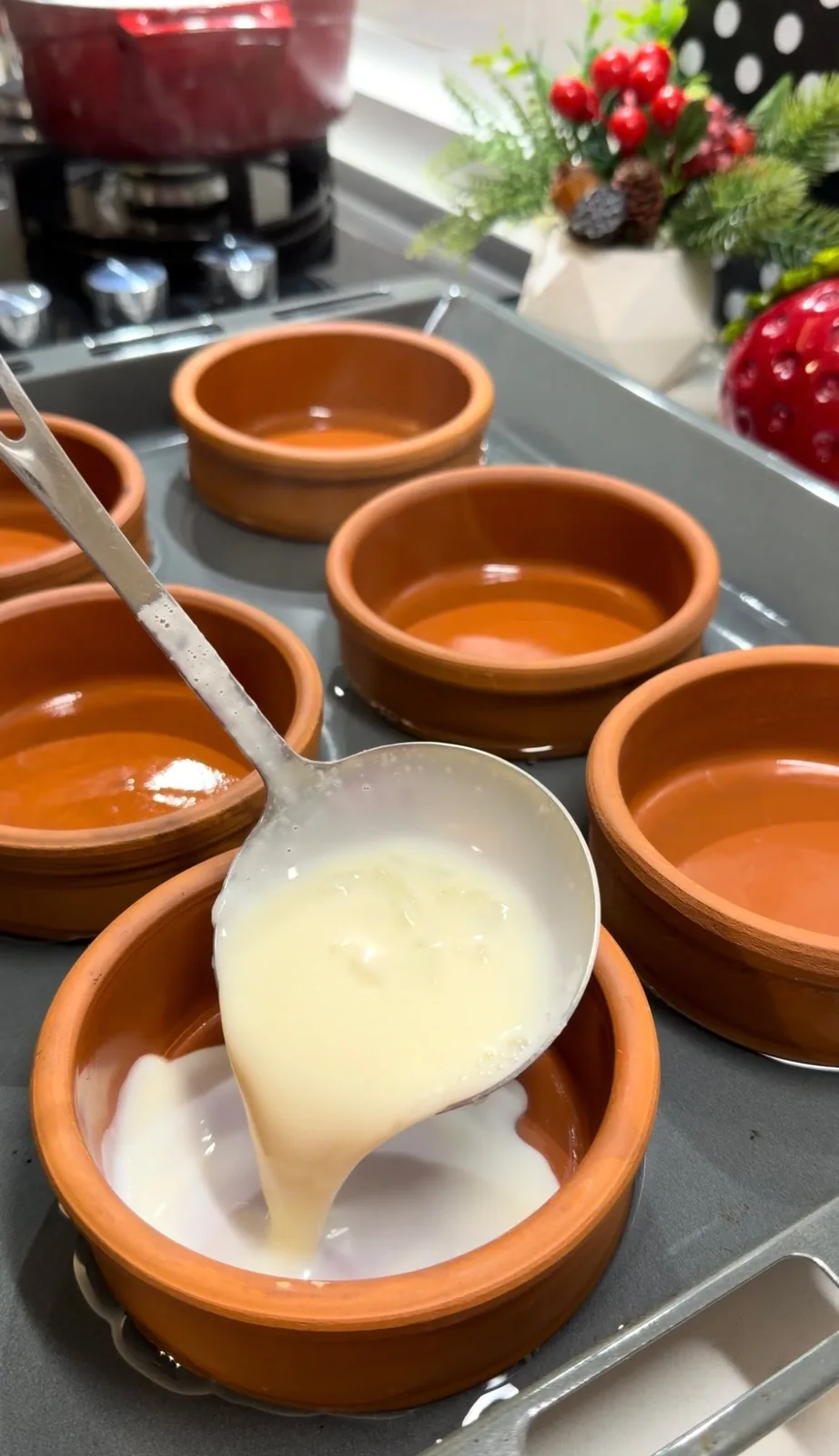 creamy Turkish rice pudding ladled into individual oven-safe clay dishes