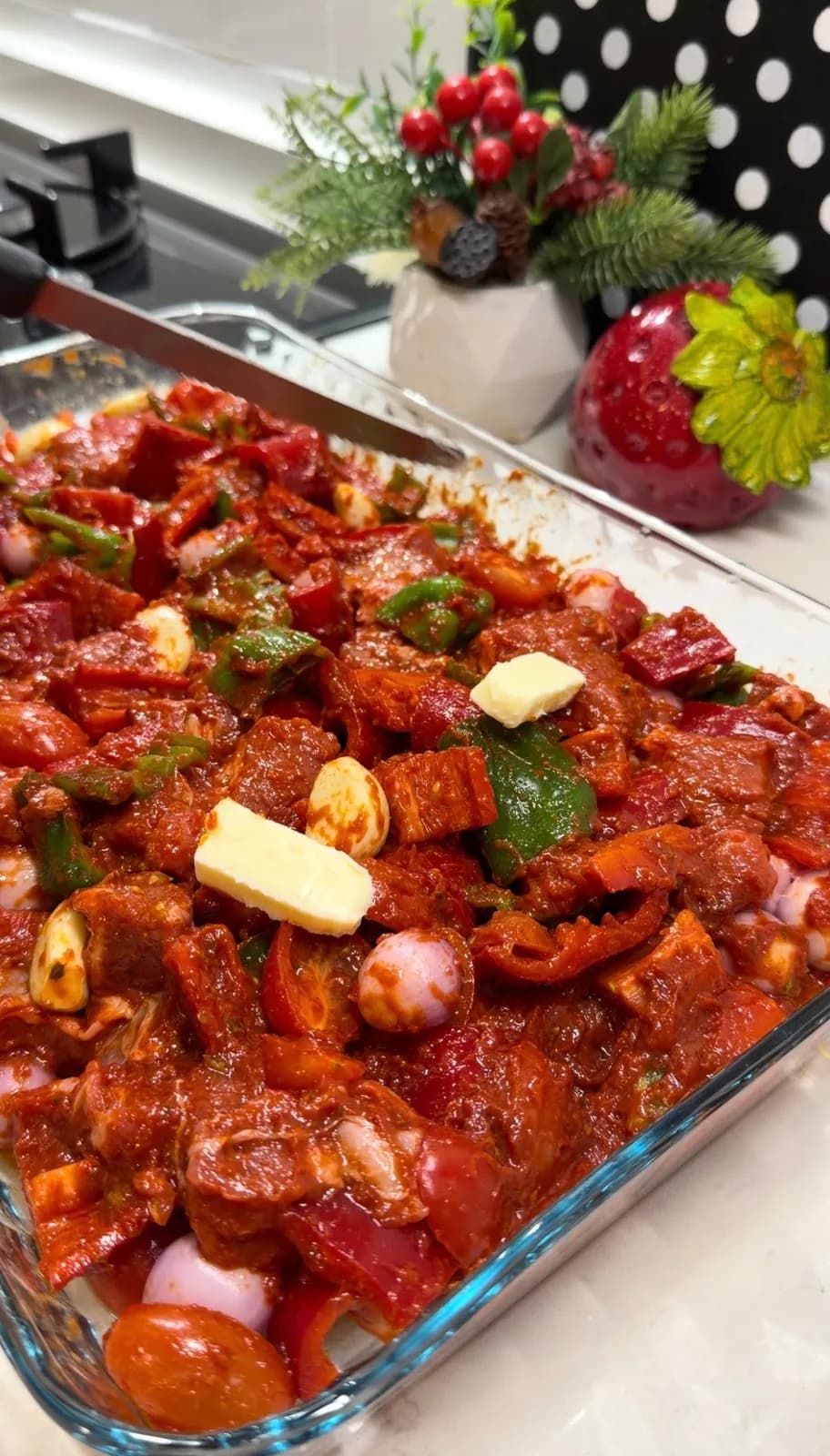 Belen Tava beef and vegetables coated in tomato pepper sauce before baking