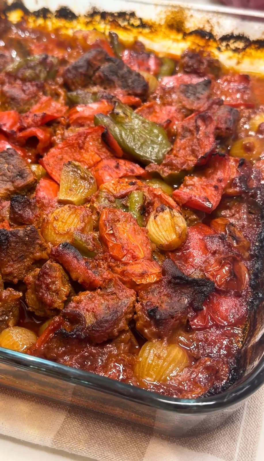 Belen Tava beef and vegetables coated in tomato pepper sauce before baking