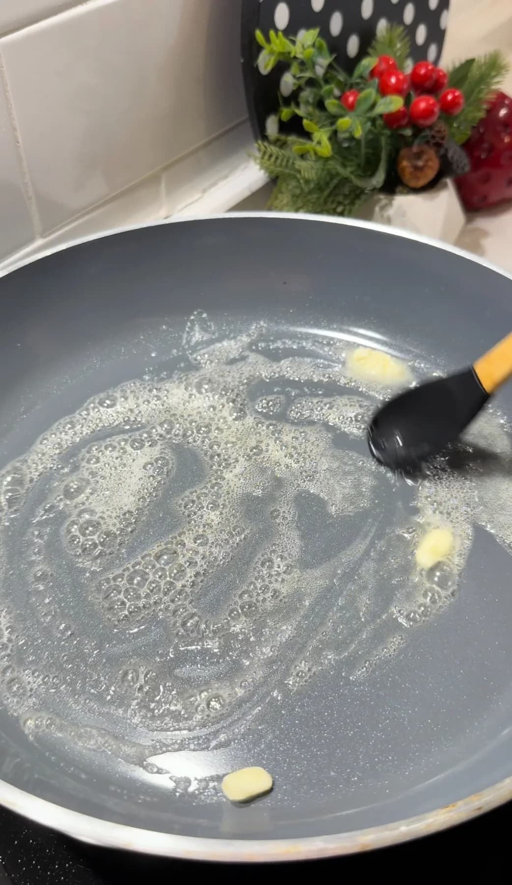 Butter melting in a skillet for caramelized peaches