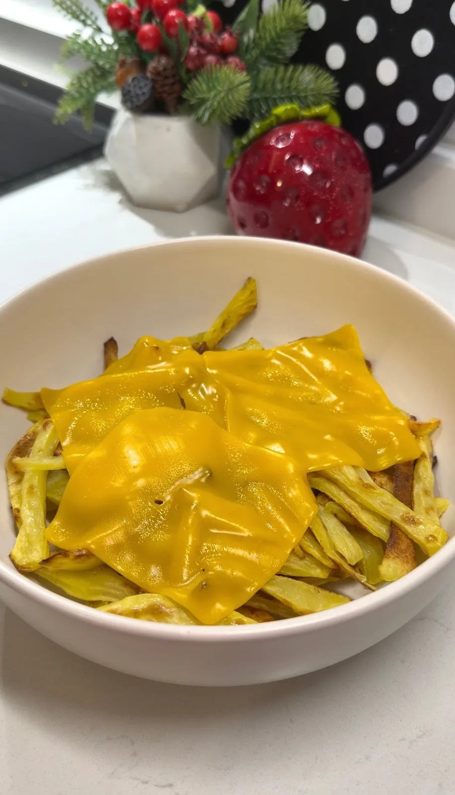 golden fries topped with melted cheddar cheese for a chicken burger bowl