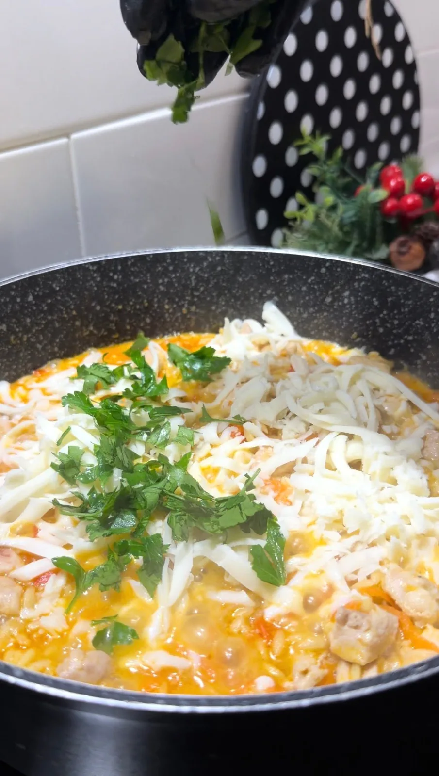 grated cheese and fresh parsley added to creamy chicken orzo pilaf