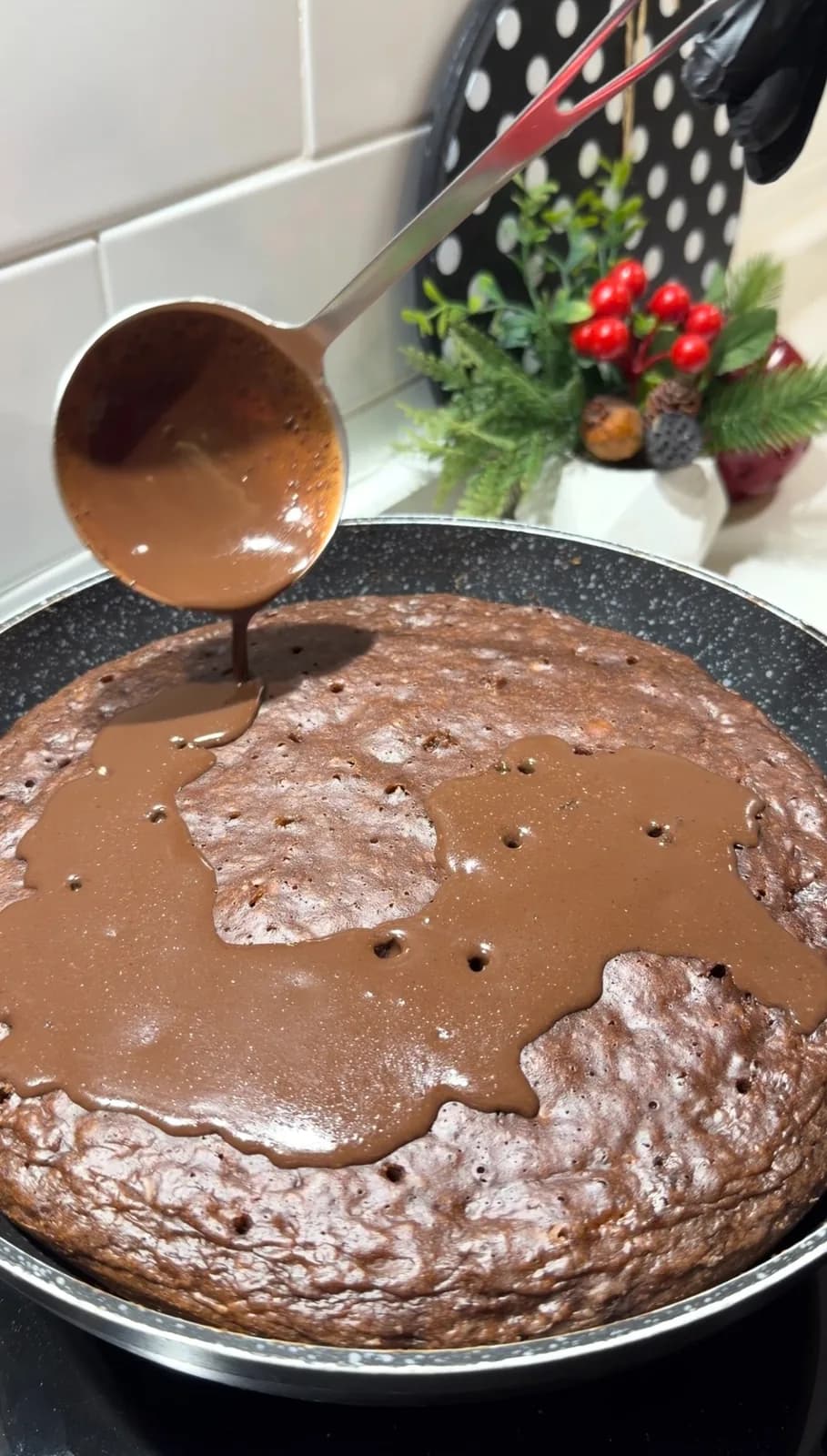 homemade chocolate sauce spread over pan-cooked banana cake