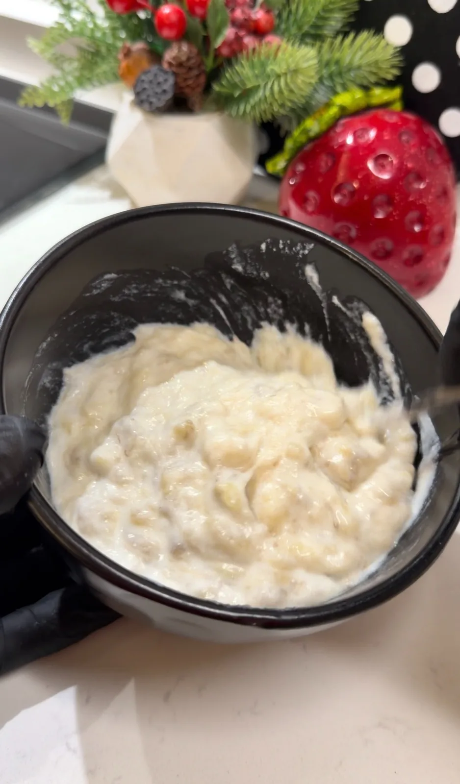 Honey being added to mashed bananas and yogurt