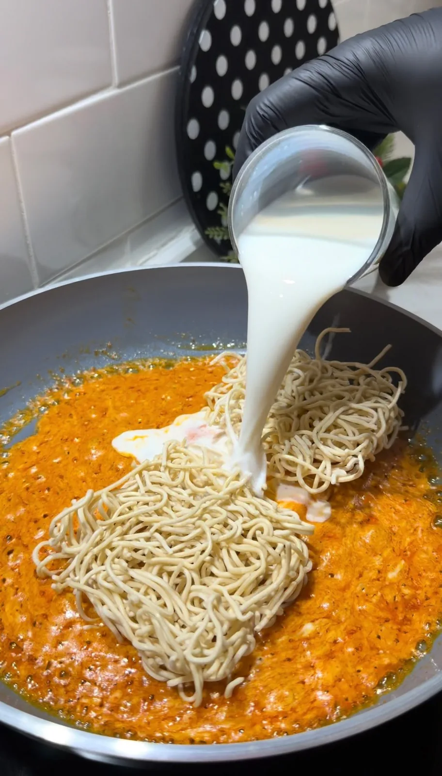 cheddar cheese melting in a pan for creamy cheesy noodles