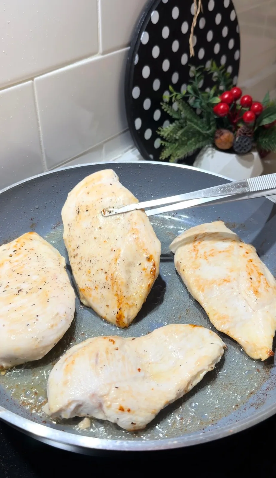 chicken breasts lightly seared in a frying pan before adding creamy sauce