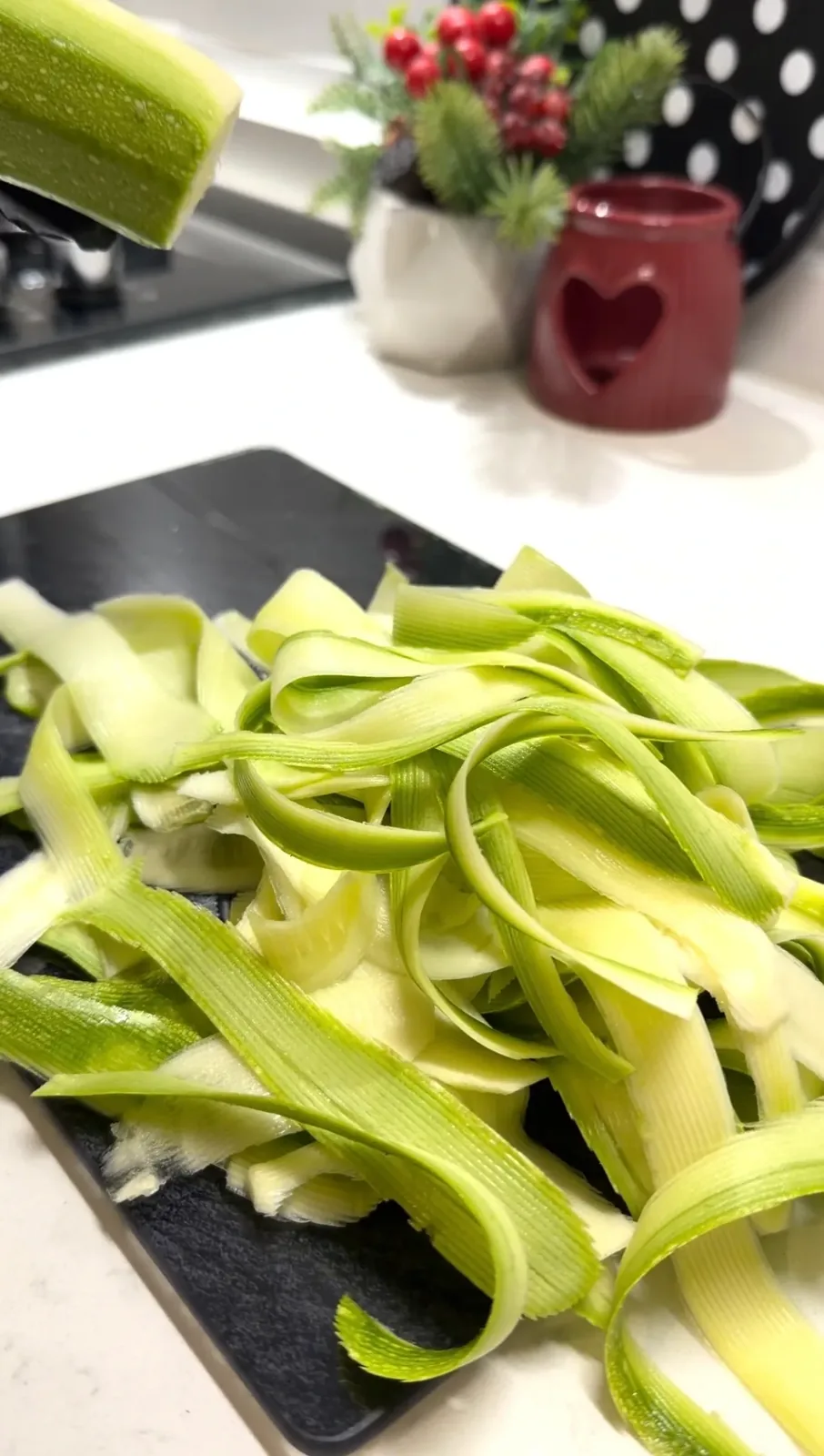 thin zucchini ribbons prepared for creamy garlic zucchini skillet