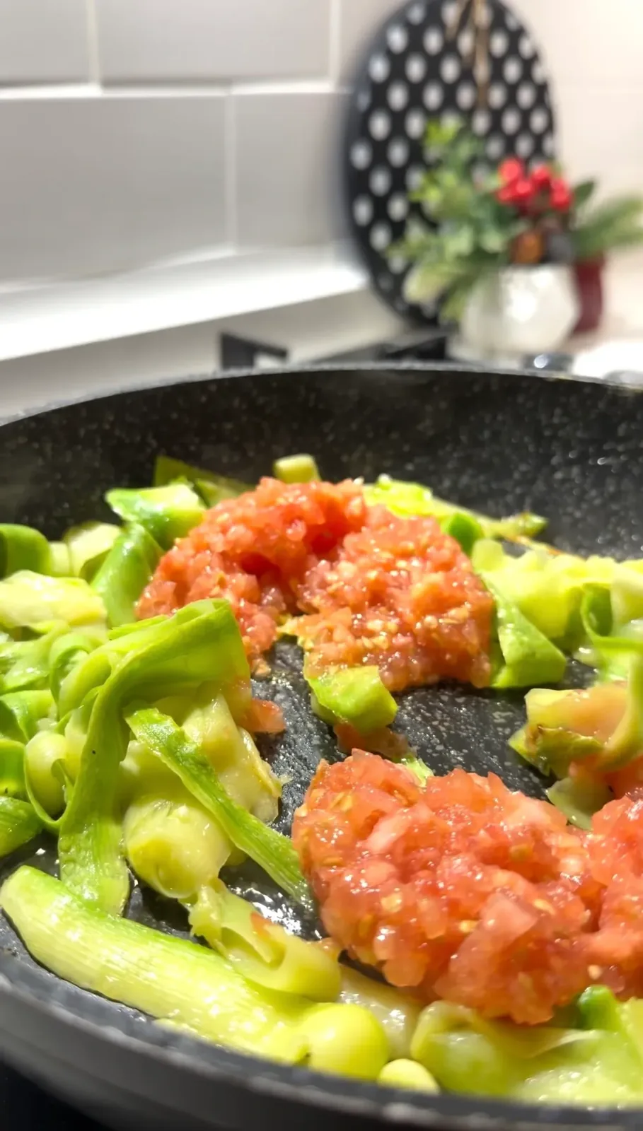 zucchini ribbons cooking with grated tomatoes garlic and tomato paste