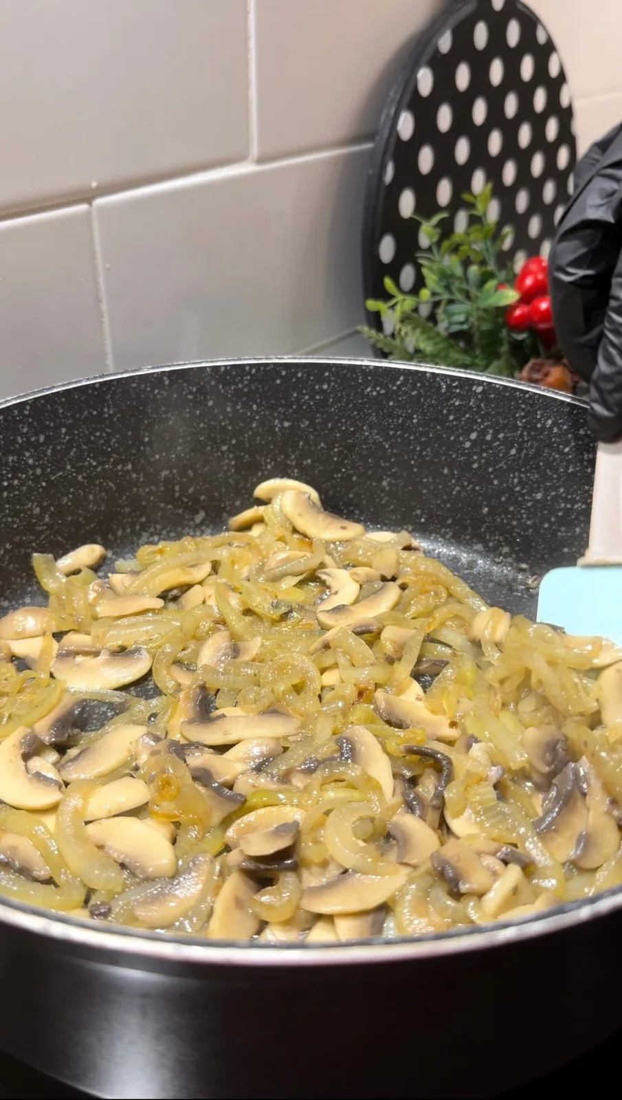 creamy mushroom orzo with melted cheese and sliced mushrooms served on a plate