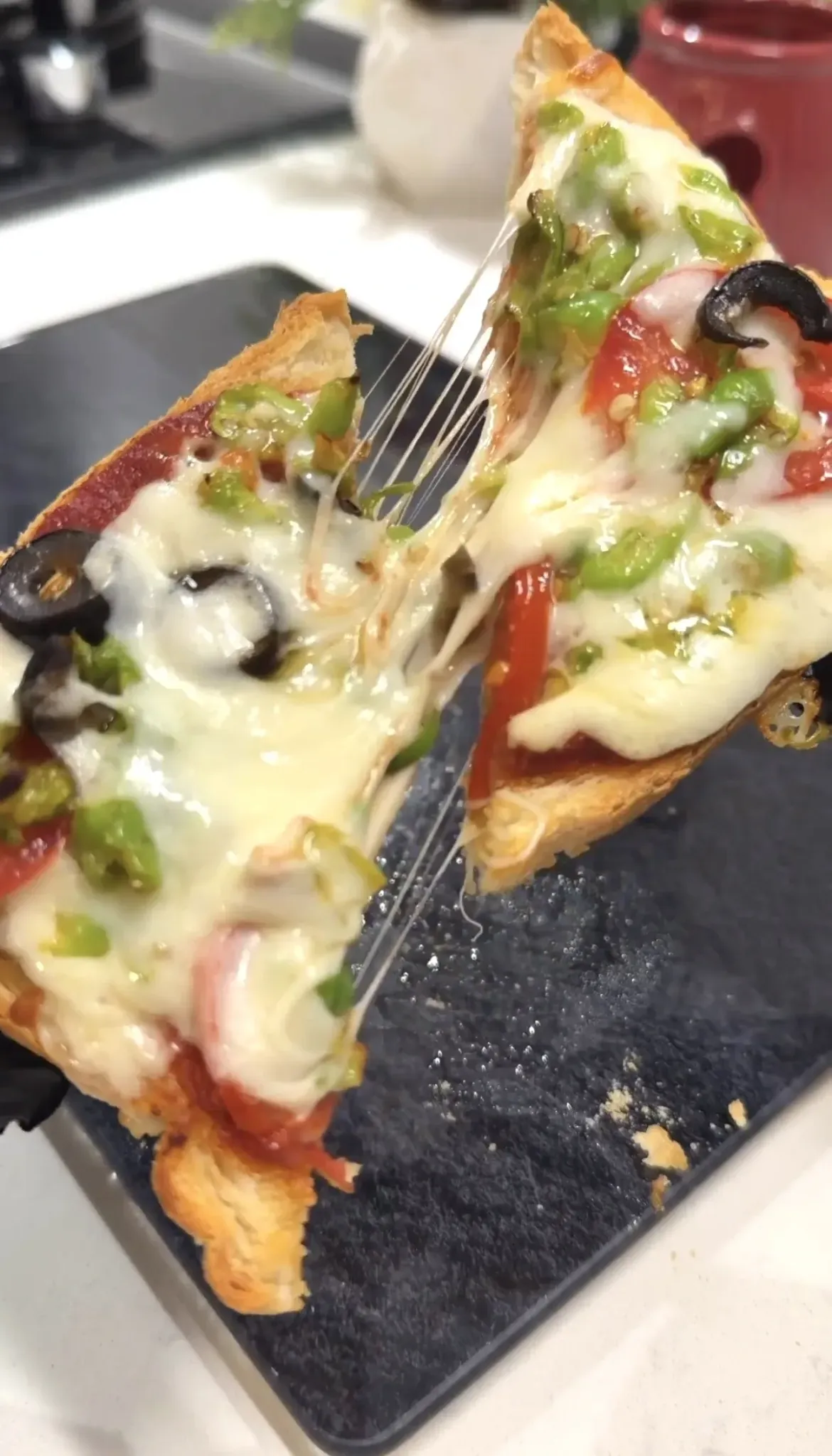 Easy homemade bread pizza with melted cheese and vegetable toppings ready to serve