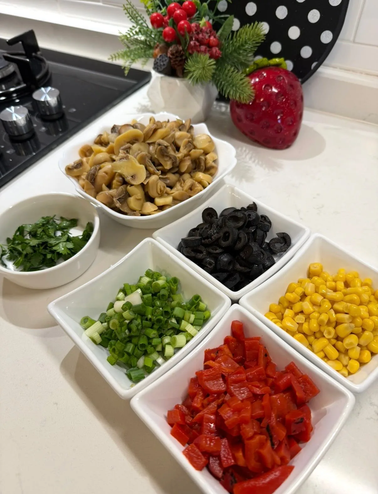 pickled mushrooms, corn, black olives, red peppers, green onions, and parsley prepared for mushroom salad