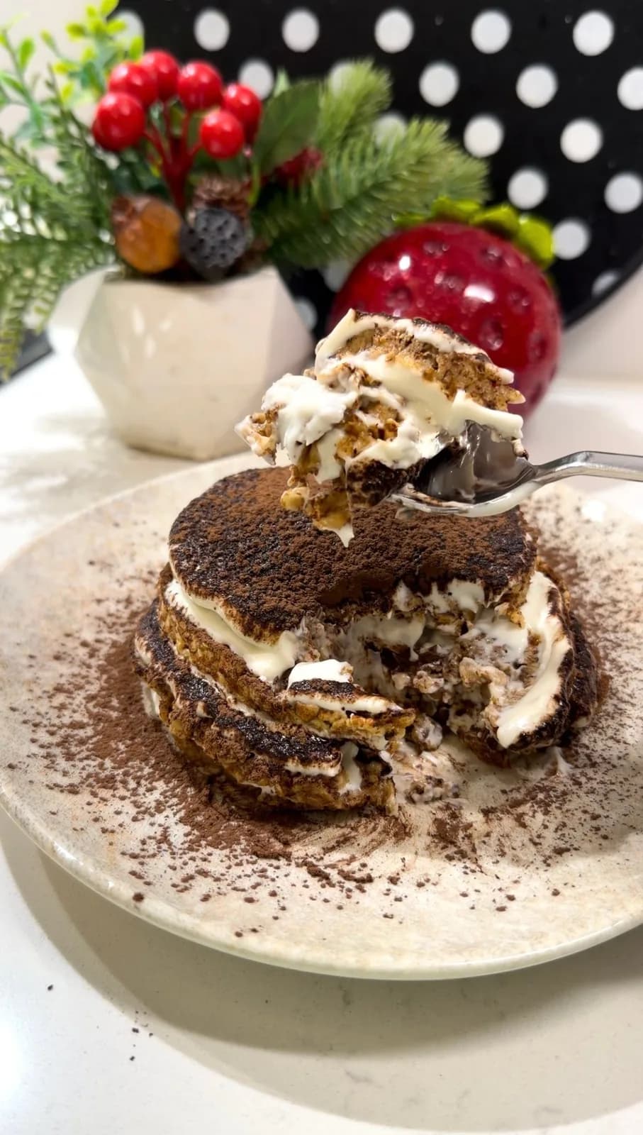 spoonful of fit tiramisu showing creamy coffee soaked layers