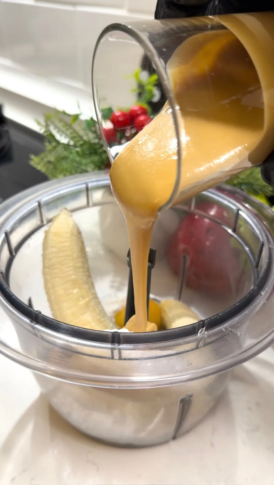bananas and peanut butter added to a blender for flourless banana muffins