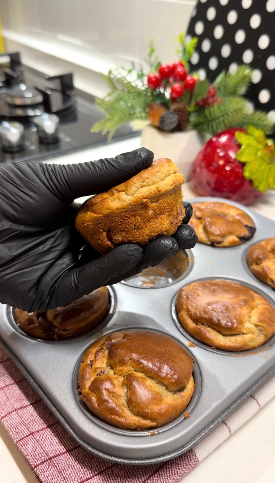 golden flourless banana muffins freshly baked in a muffin pan