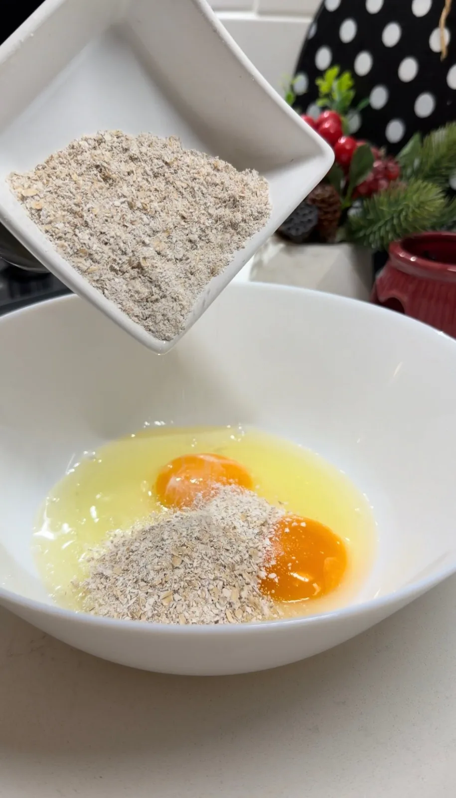 eggs and gluten-free oats being combined for vegetable pancakes
