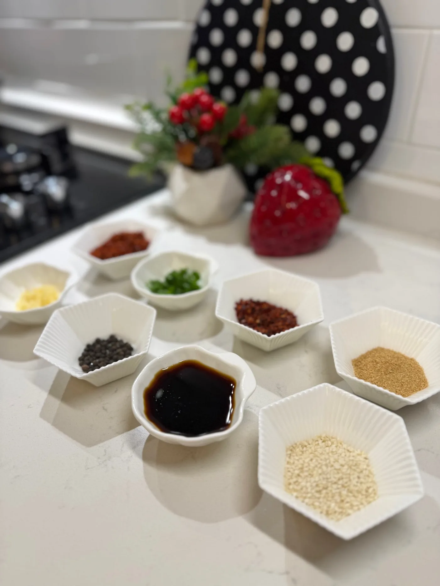 Chili flakes and seasonings combined in a heatproof bowl for homemade chili oil