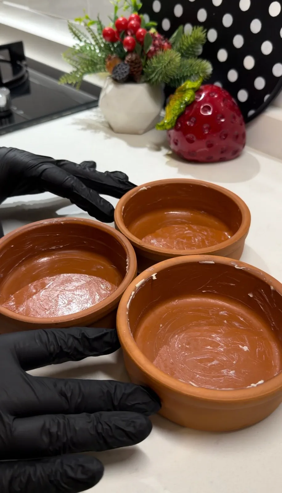 small clay baking dishes greased with butter for Turkish kunafa