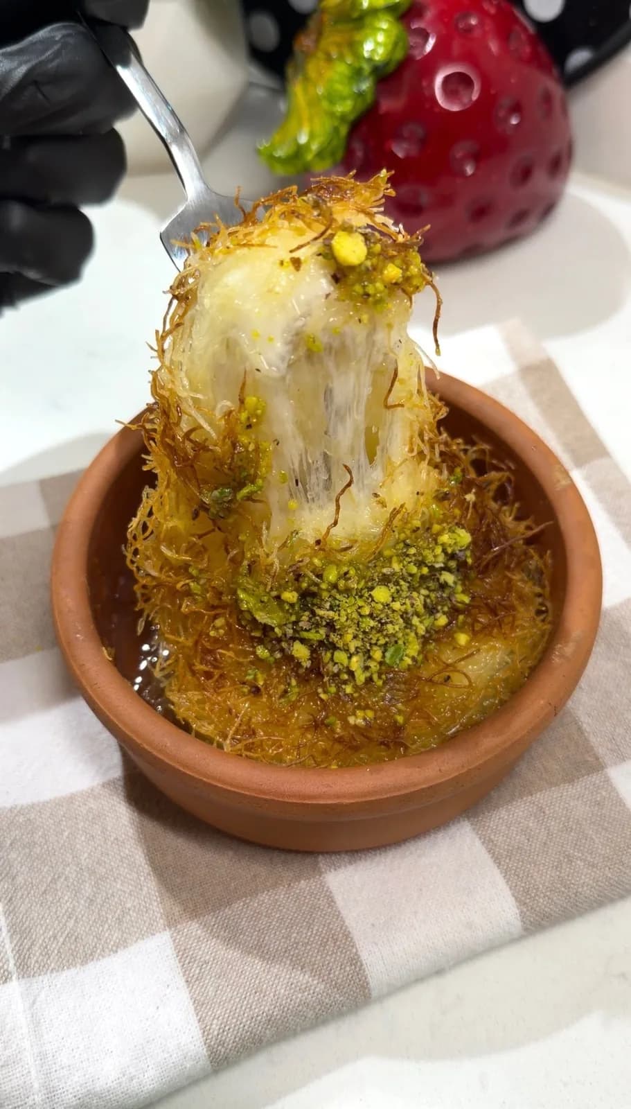 warm Turkish kunafa with stretchy melted cheese and pistachios