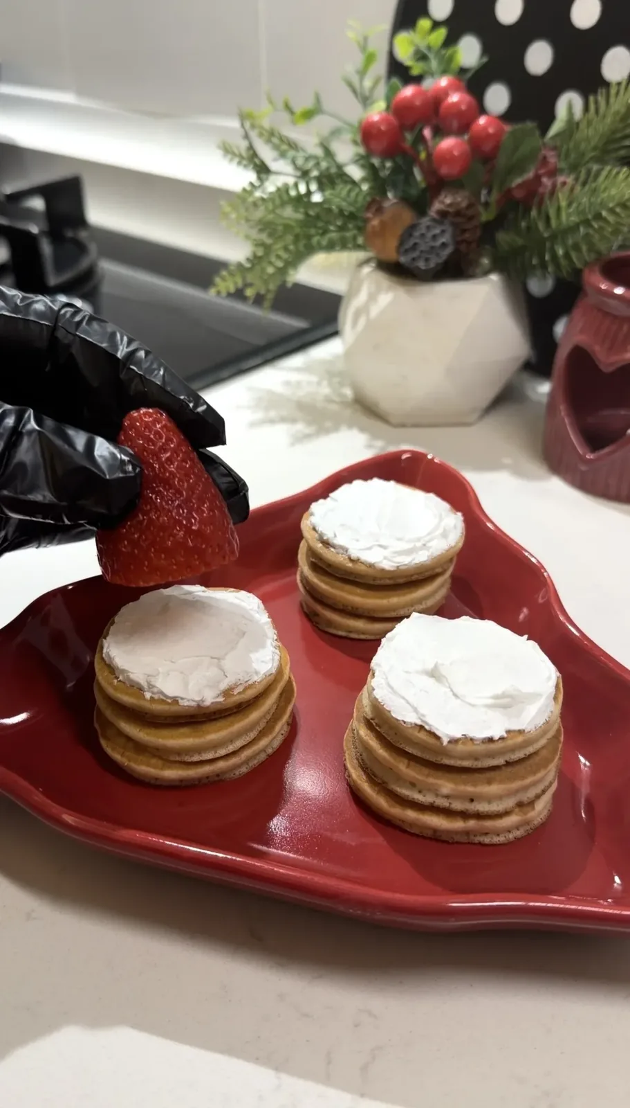 Christmas mini pancake stacks with whipped cream and fresh strawberries