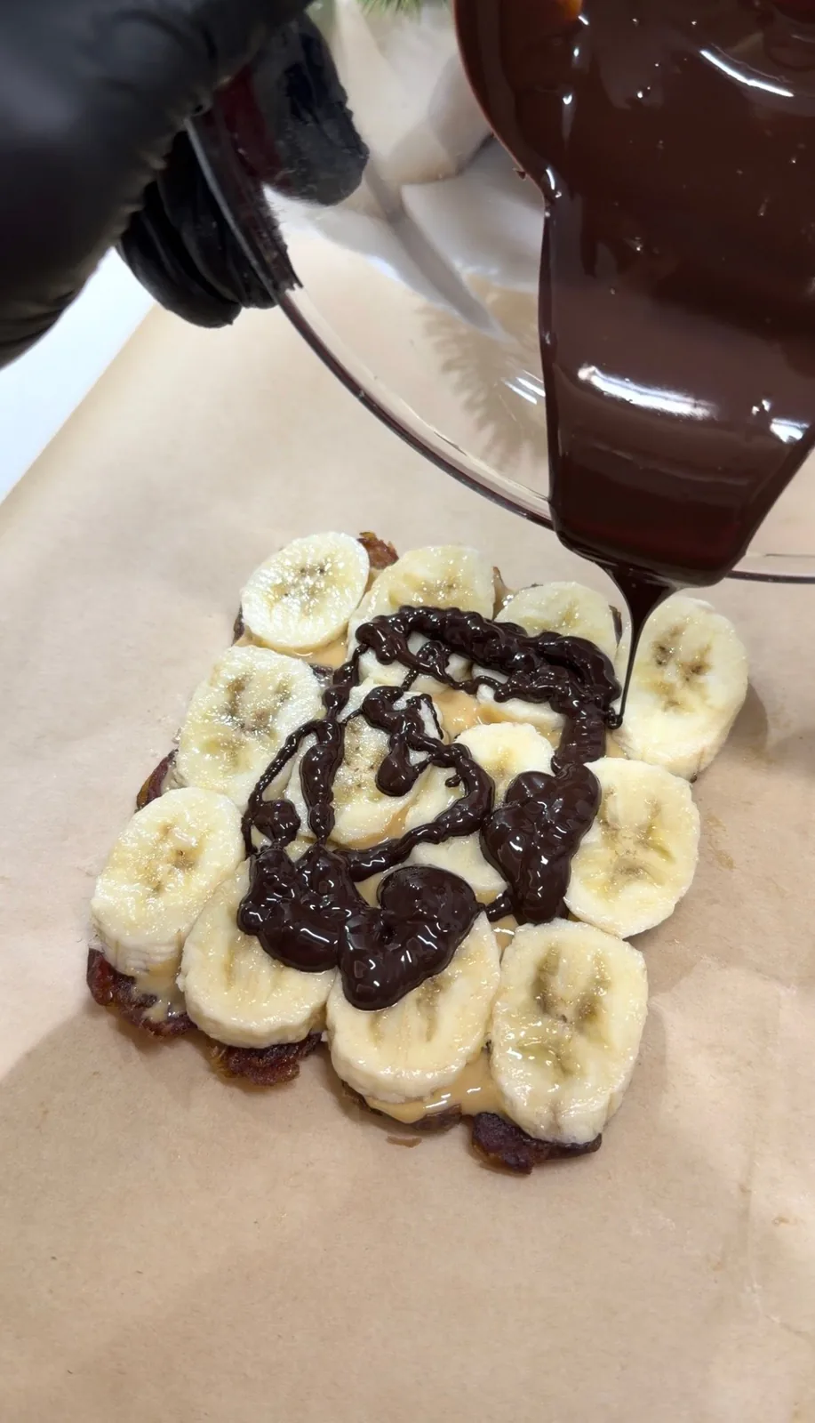 melted dark chocolate poured over banana peanut butter and dates
