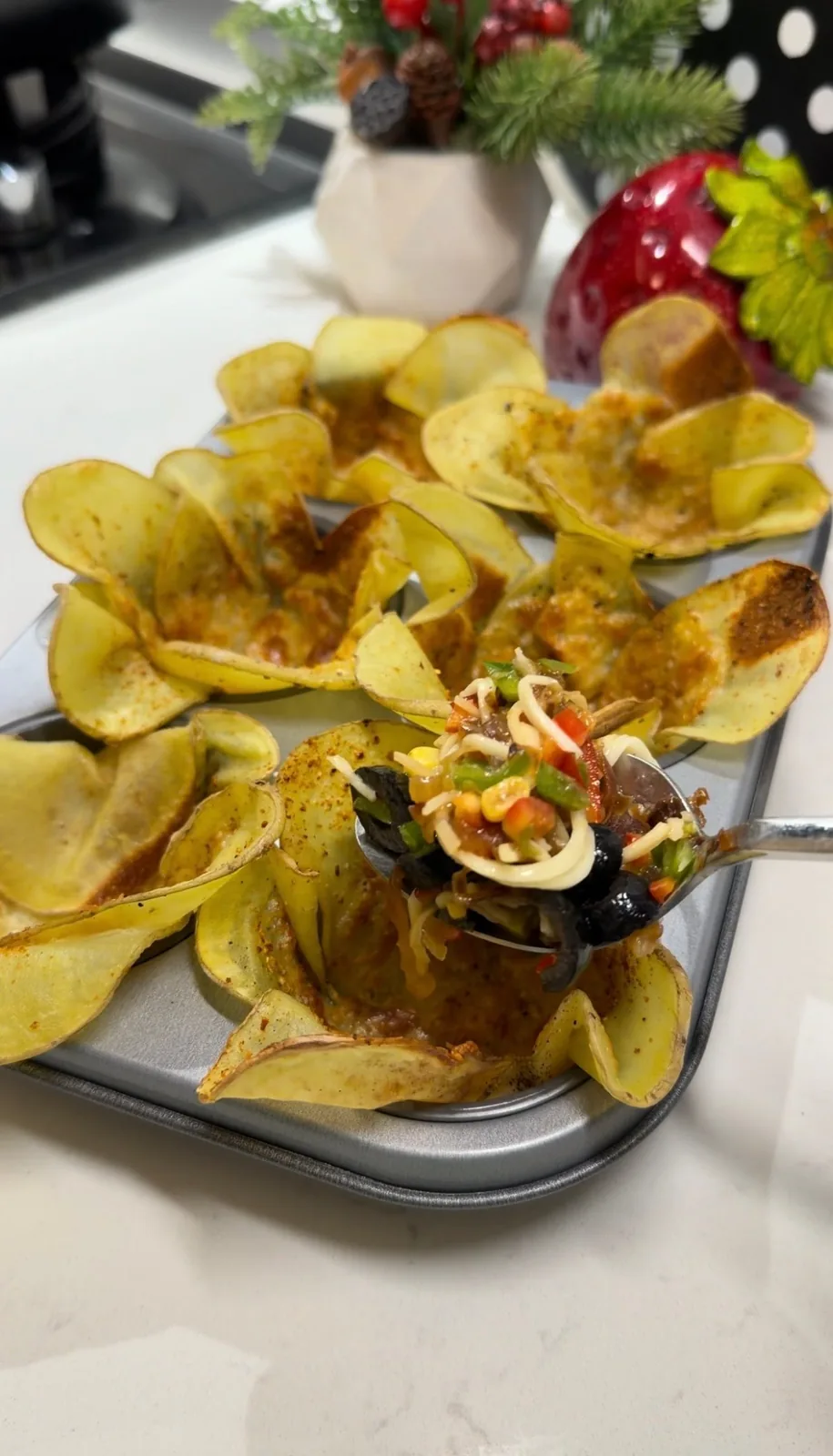baked potato flower cups filled with vegetables, olives, corn and cheese