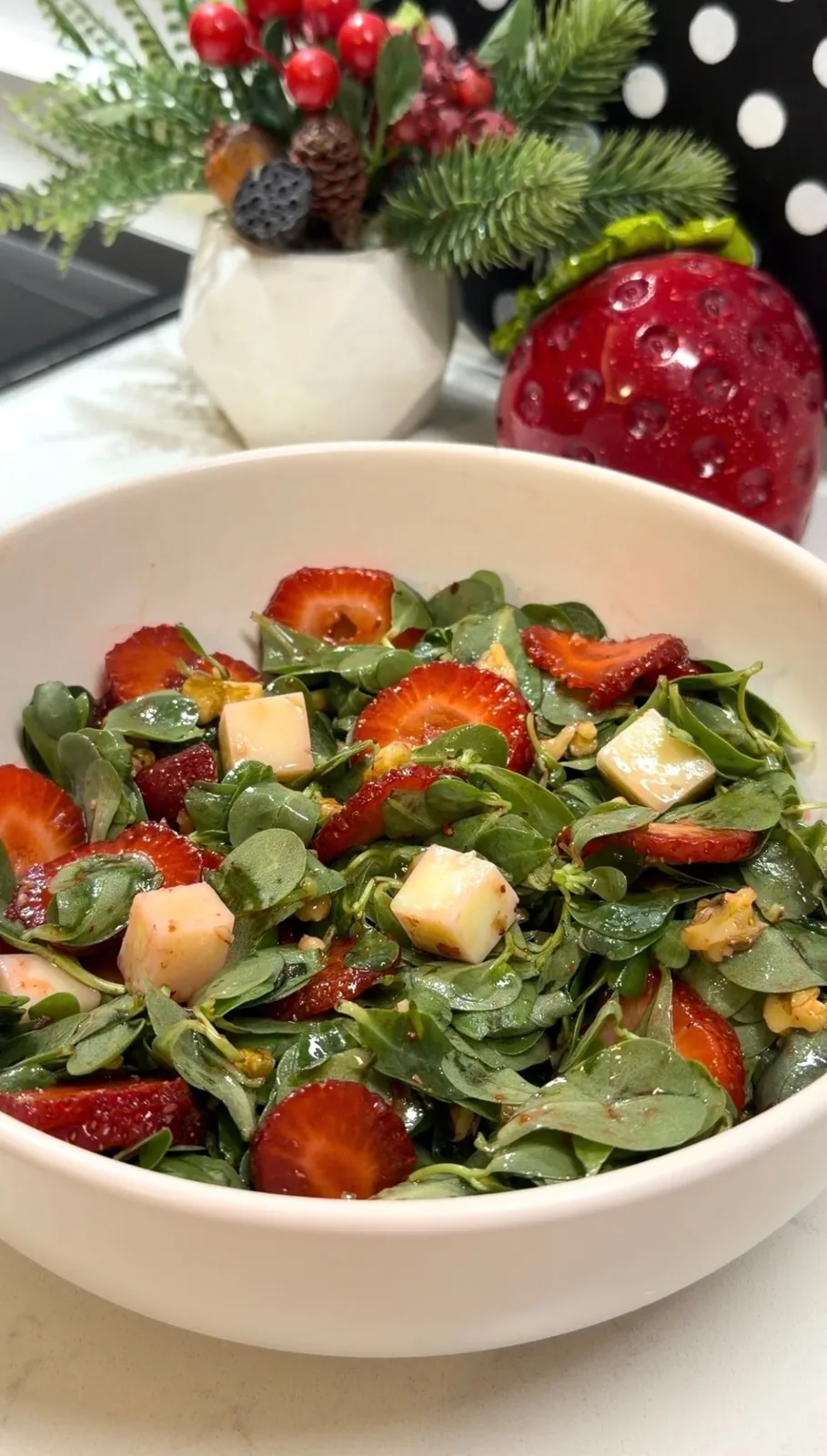 finished strawberry purslane salad with walnuts and cubes of aged kasar cheese