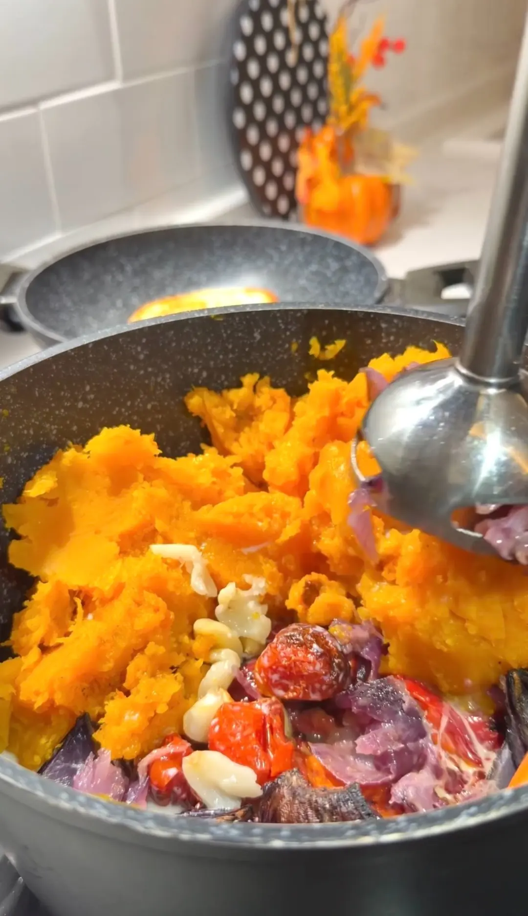 Roasted butternut squash soup being blended until smooth