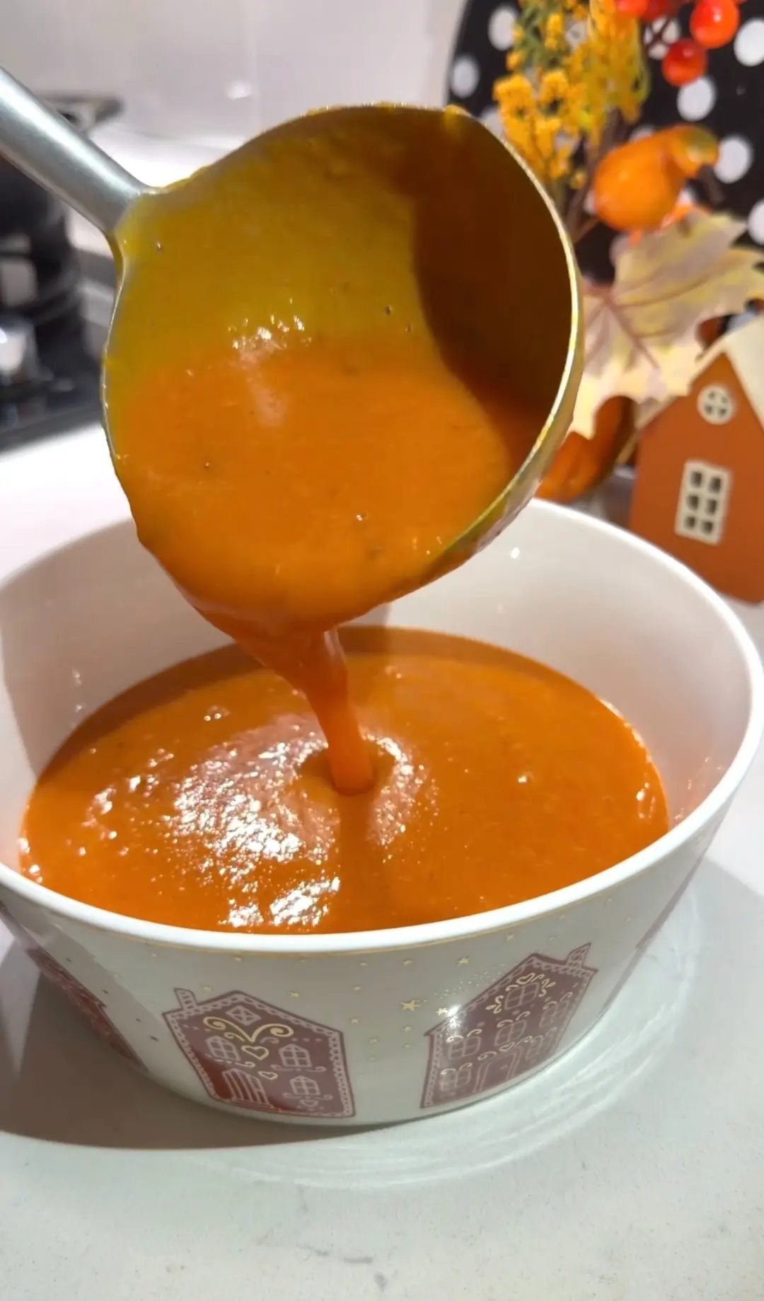 Creamy roasted butternut squash soup topped with sliced green onions
