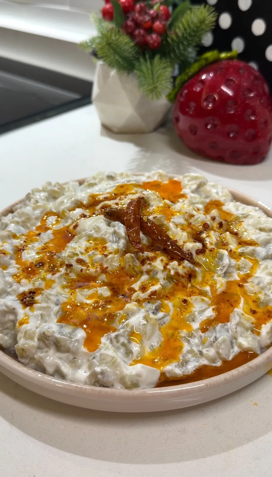 Creamy roasted eggplant yogurt dip topped with spicy butter