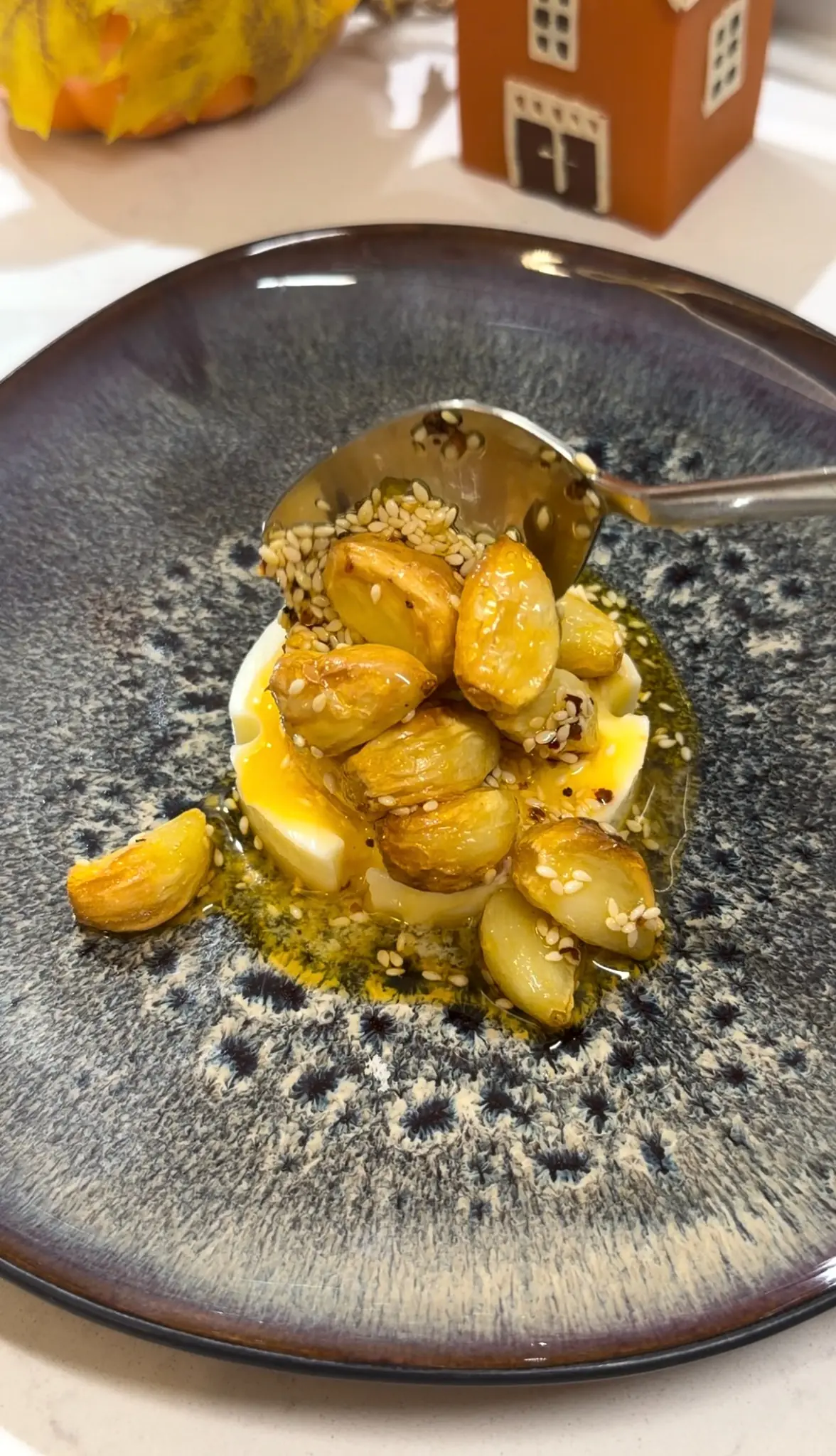 Soft roasted garlic mashed with butter and fresh parsley to make garlic bread spread.