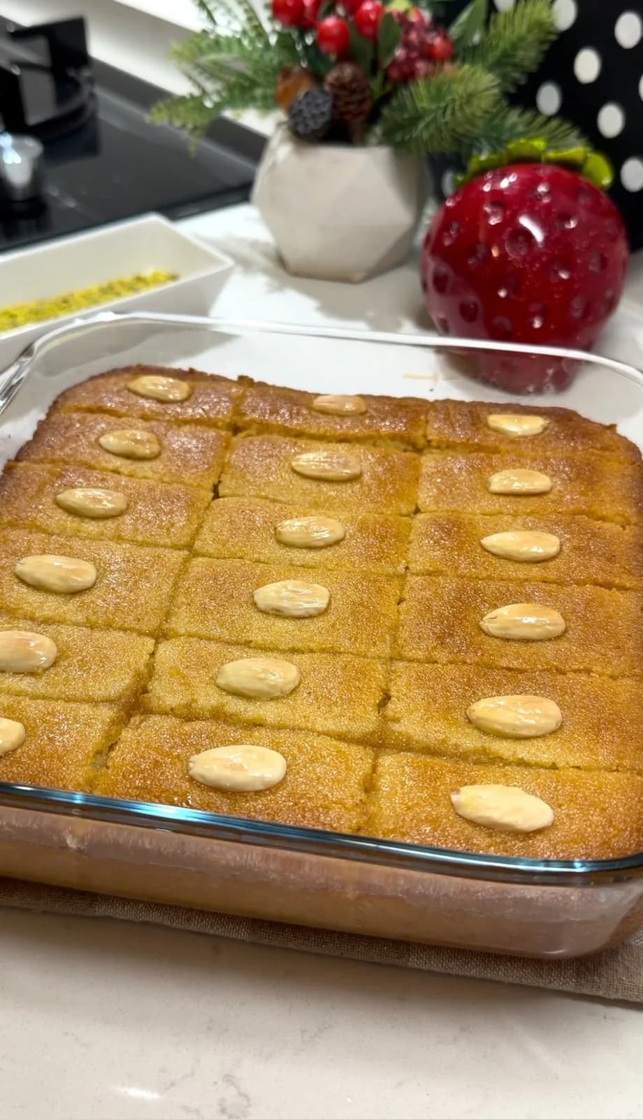 golden baked Turkish Şambali dessert topped with almonds