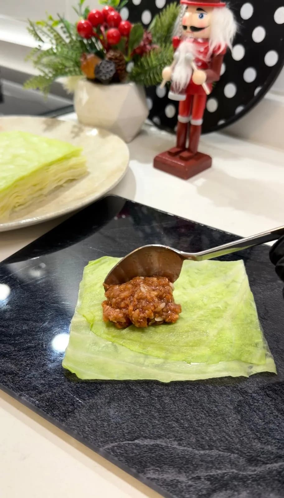 Turkish stuffed cabbage rolls in tomato sauce served with yogurt
