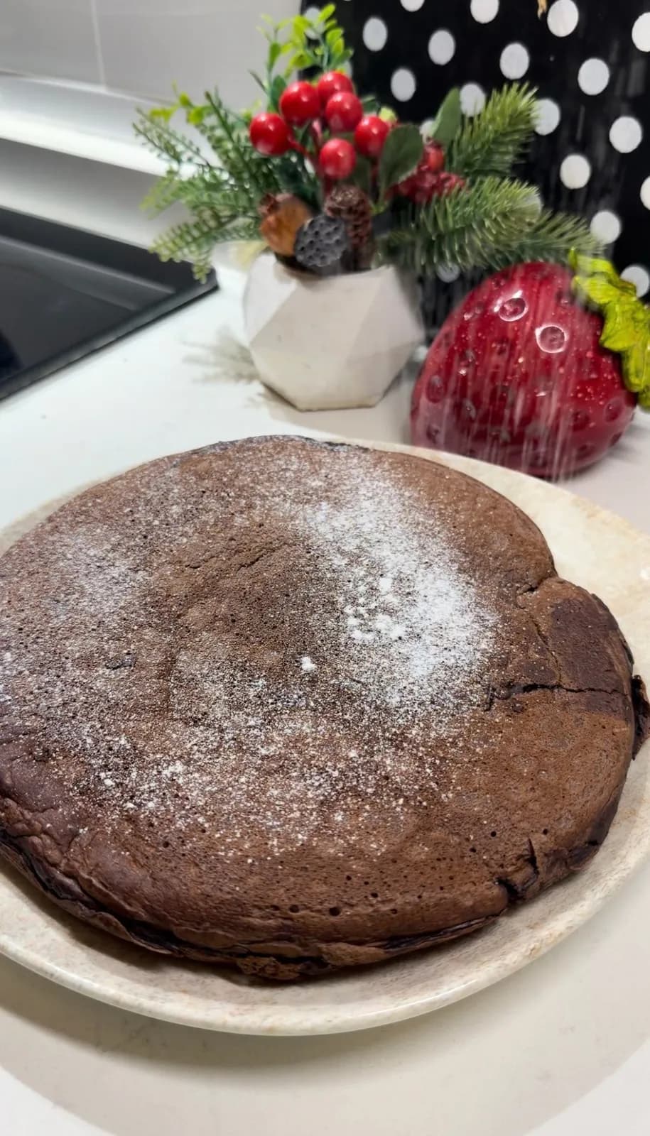 Chocolate stuffed pancake cut open with melted chocolate and fruit filling
