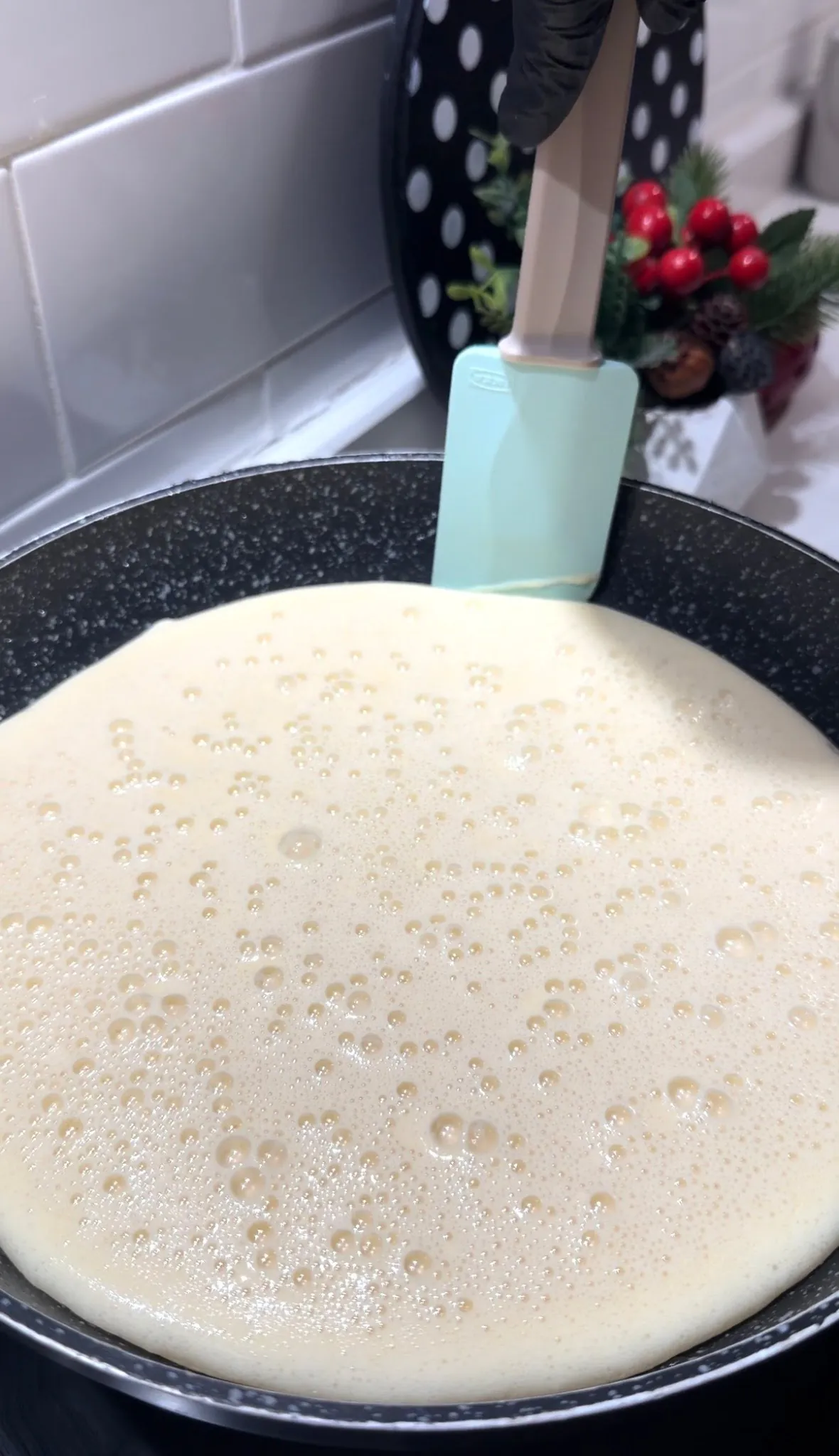 Dark chocolate placed in the center of fluffy pancake batter