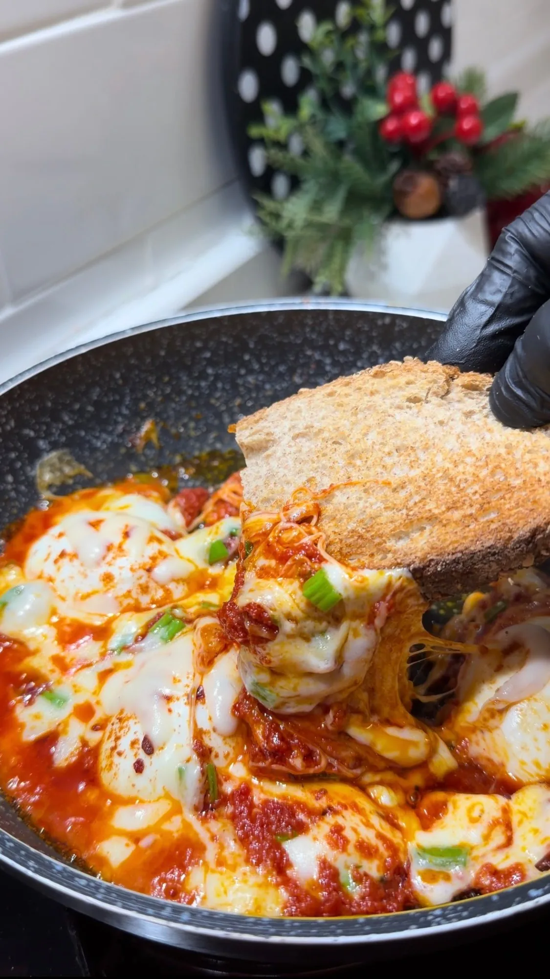 Turkish-style tomato eggs with melted cheese served on toasted bread