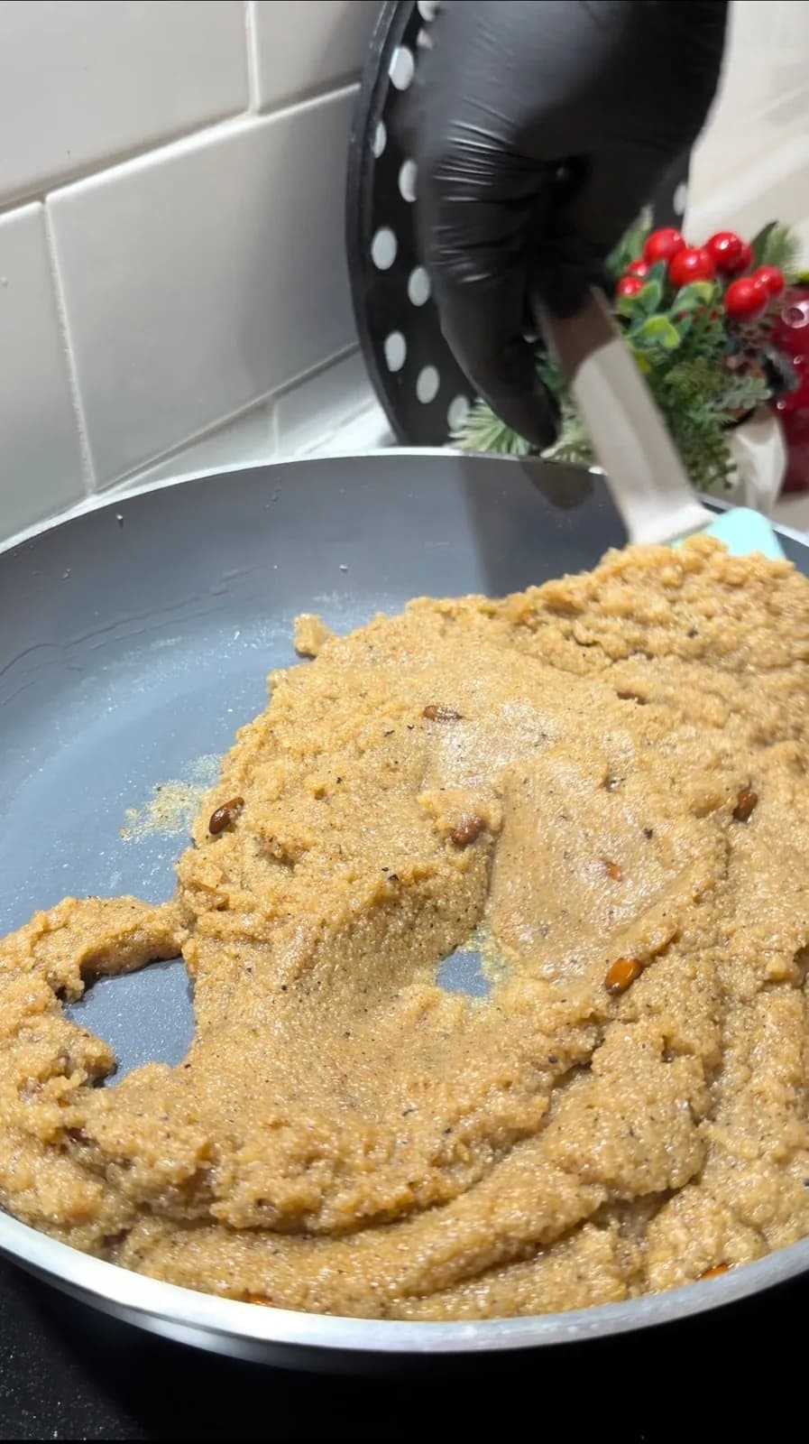 thick Turkish semolina halva cooking in a pan