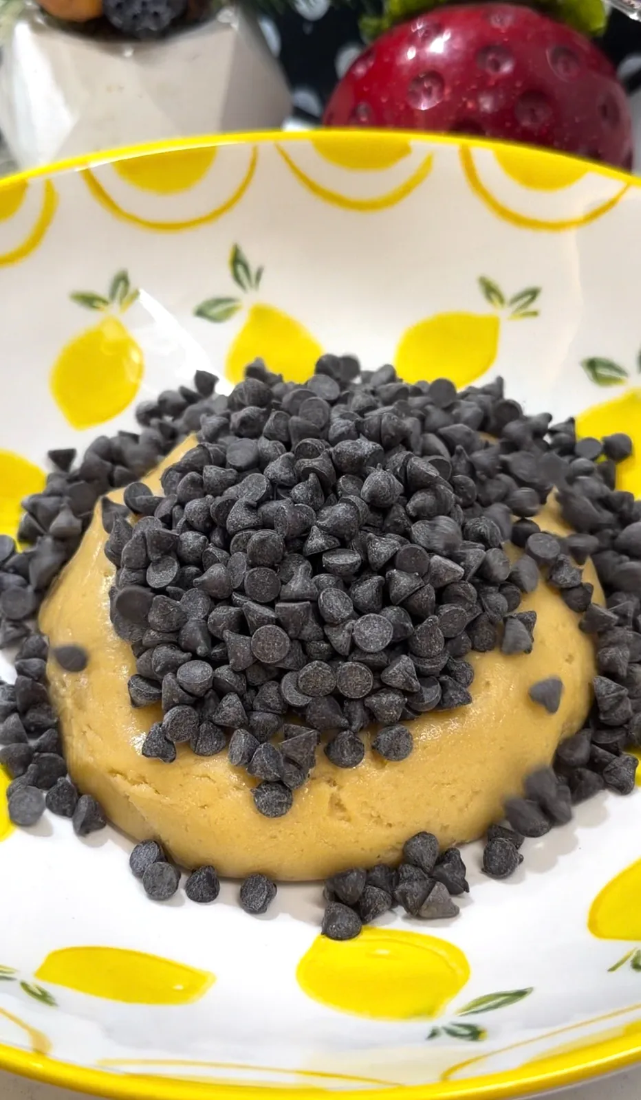 Chocolate chips added to homemade cookie dough
